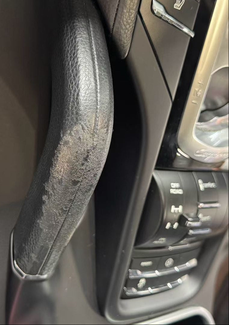 Worn Porsche leather seat bolster before repair in Sydney